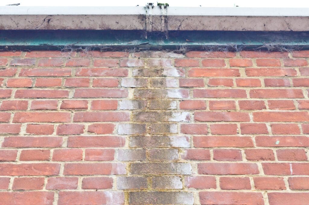 brickwork water damaged caused by leaking gutters